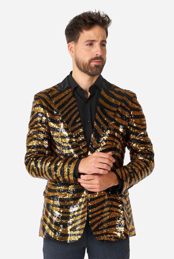 Man wearing black and gold sequins tiger stripe blazer