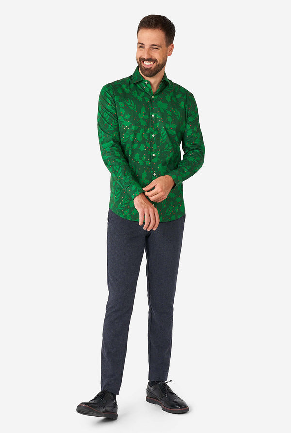 Man wearing green Christmas dress shirt with holly and mistletoe print