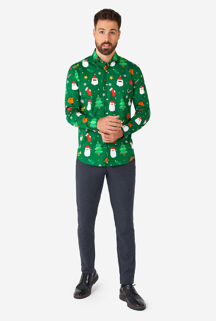 Man wearing green Christmas dress shirt with Christmas icons