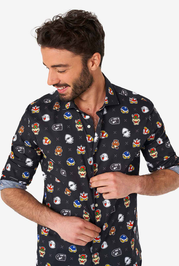 Man wearing black dress shirt with Super Mario bad guys icons