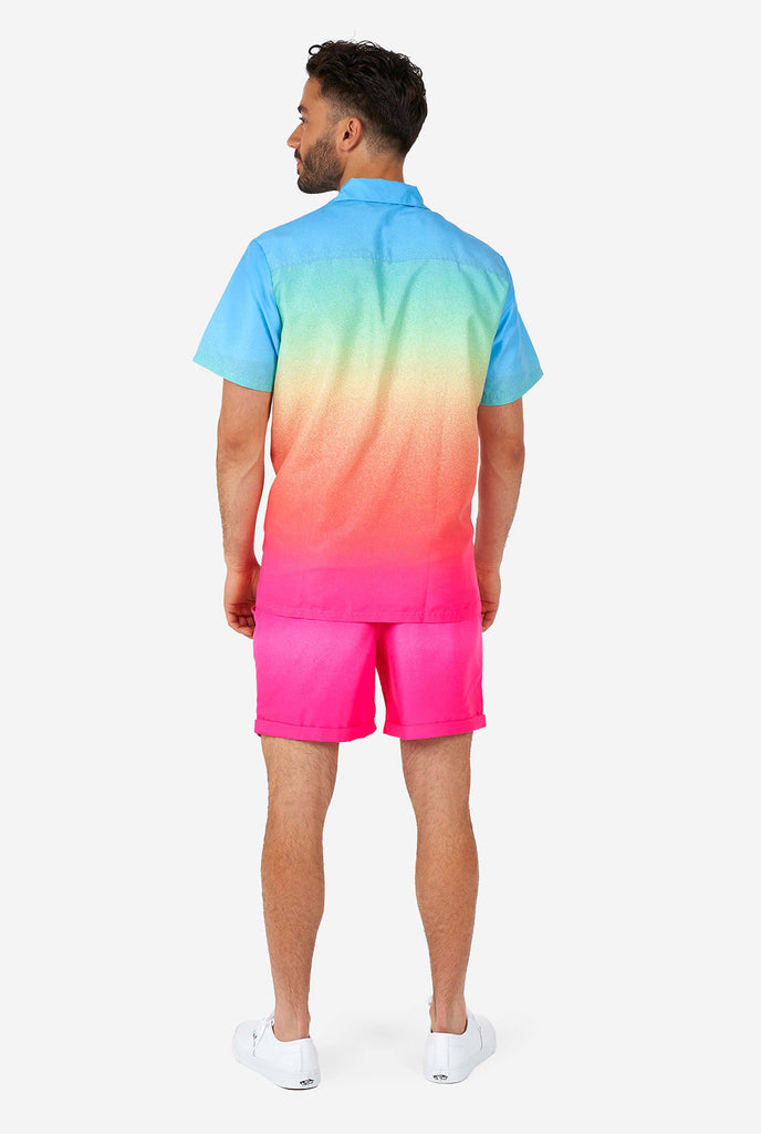 Man wearing colorful summer shorts and shirt