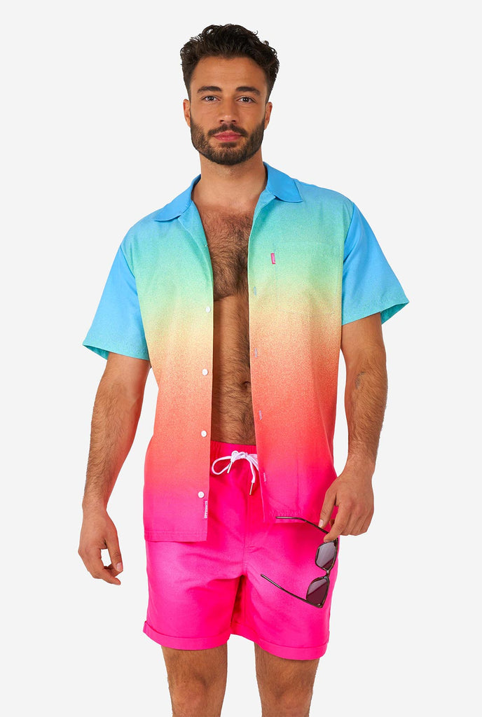 Man wearing colorful summer shorts and shirt