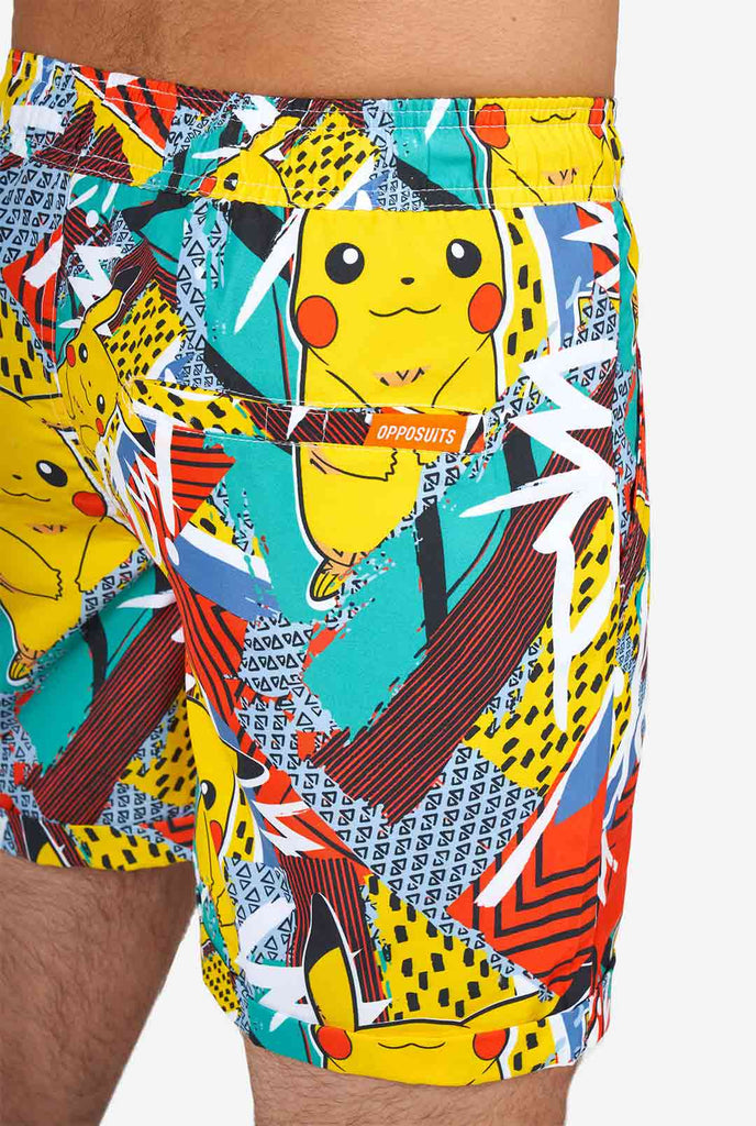Man wearing colorful summer shorts and shirt with Pikachu Pokemon print