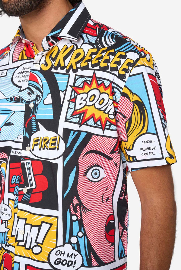 Colorful comic book style shirt with graphic designs and text, close up.
