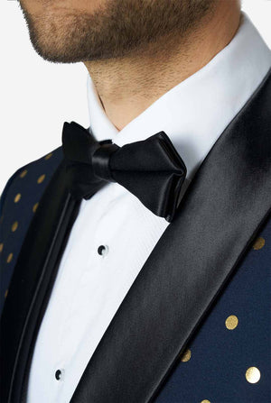 Man wearing blue tuxedo with golden dots