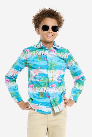 Child wearing a colorful flamingo shirt and sunglasses on a white background