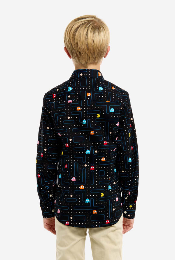 Child wearing a black jacket with colorful Pac-Man pattern on a white background