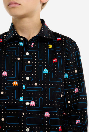 Person wearing a shirt with Pac-Man game pattern