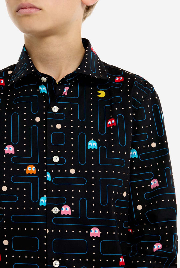Person wearing a shirt with Pac-Man game pattern