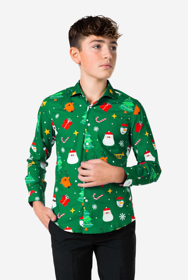 Person wearing a green Christmas-themed shirt with various festive designs on a white background