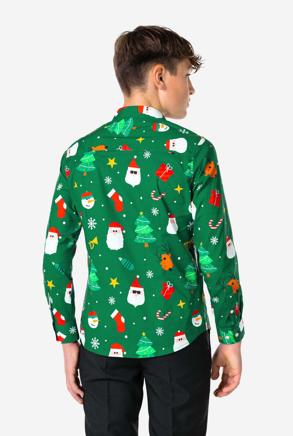 Person wearing a green Christmas-themed shirt with various festive designs on a white background