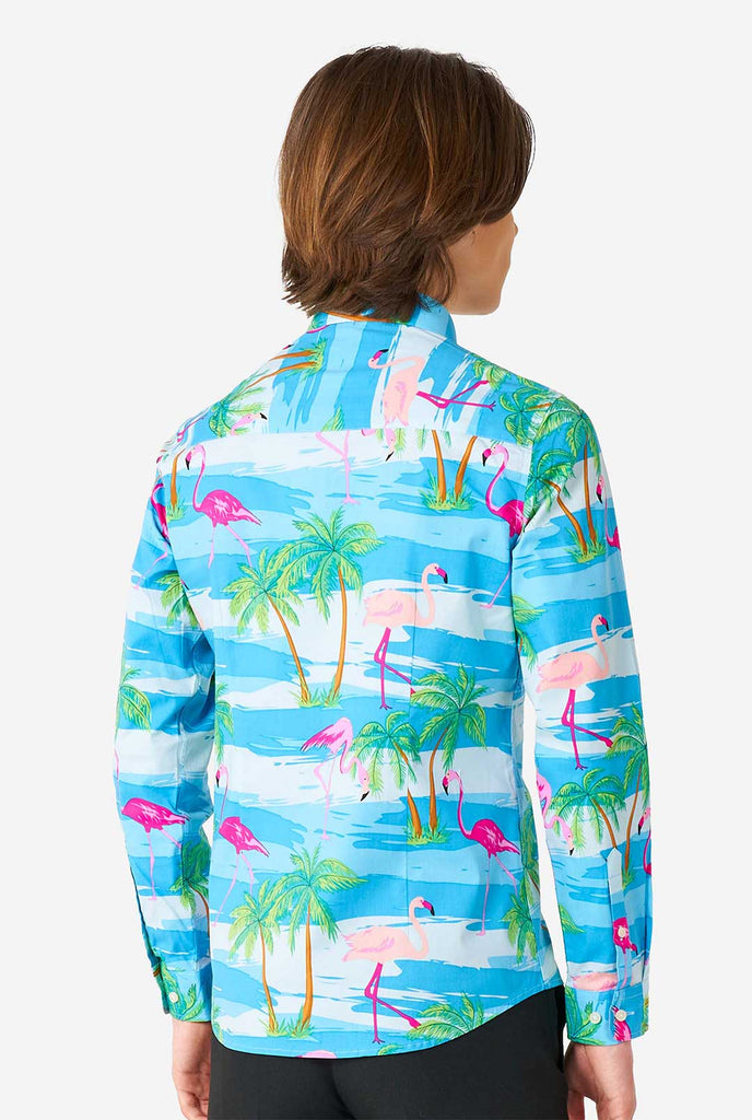 Teen wearing Hawaiian dress shirt with tropical flamingo shirt