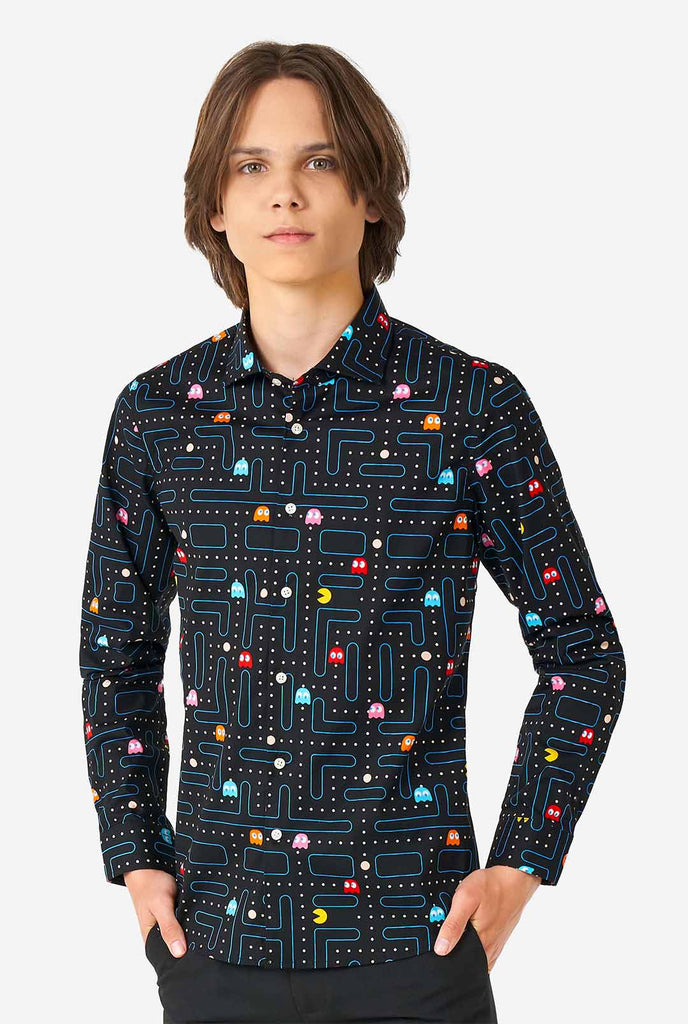 Teen wearing black dress shirt with Pac-Man print