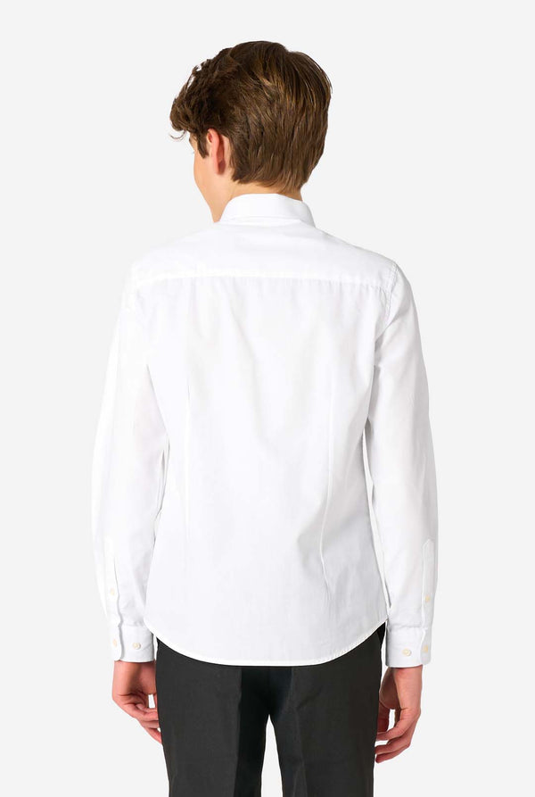 Image of long sleeve white shirt for boys worn by teen. Also wearing black pants. View from the back.