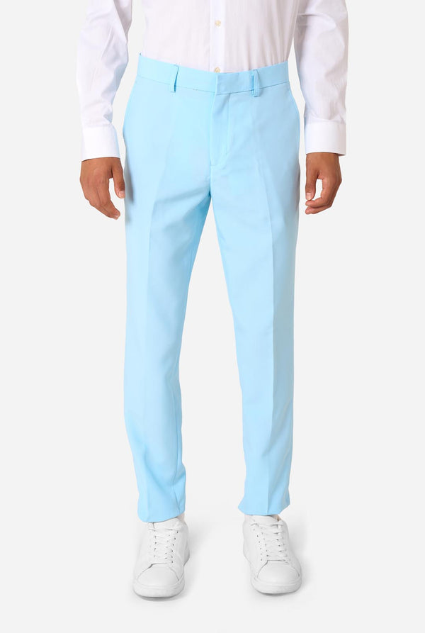 Teen wearing a light blue suit with a white shirt and tie on a light background. Pants view.