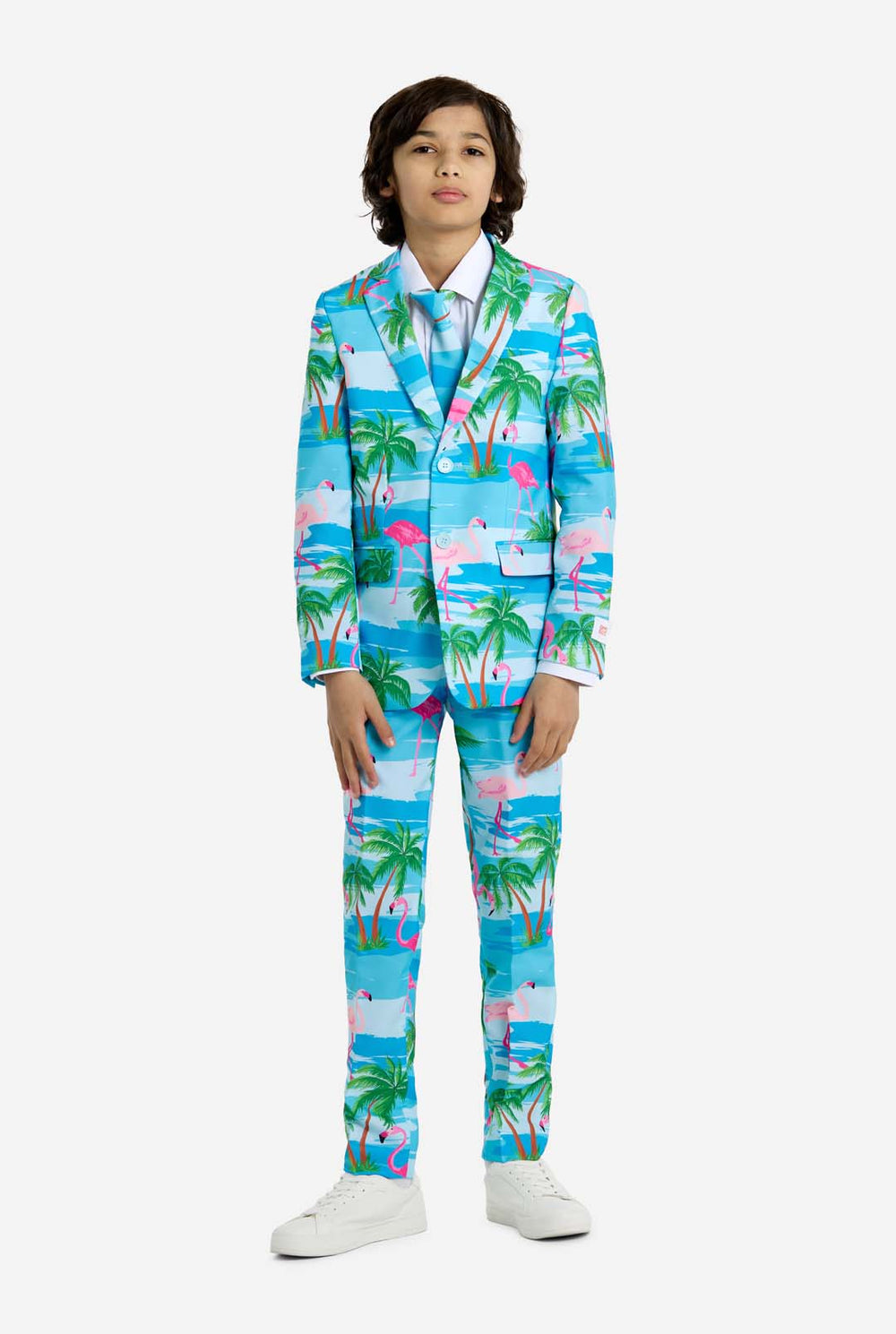 Child wearing a colorful tropical-themed suit with palm trees and flamingos on a white background