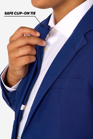 Person adjusting a blue clip-on tie on a white shirt and blue blazer.