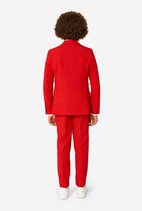 Person wearing a red suit on a white background, view from the back.