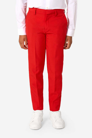 Person wearing red pants and white shoes on a white background