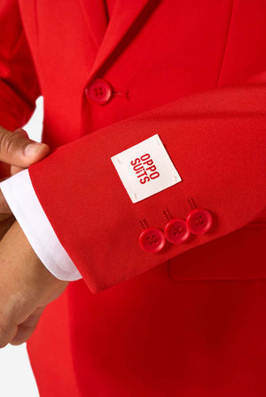 Red suit with a visible brand label on the sleeve