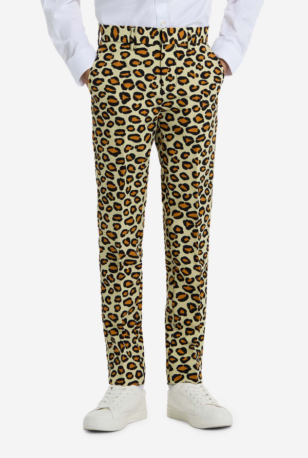 Leopard print pants worn with a white shirt and white sneakers on a white background