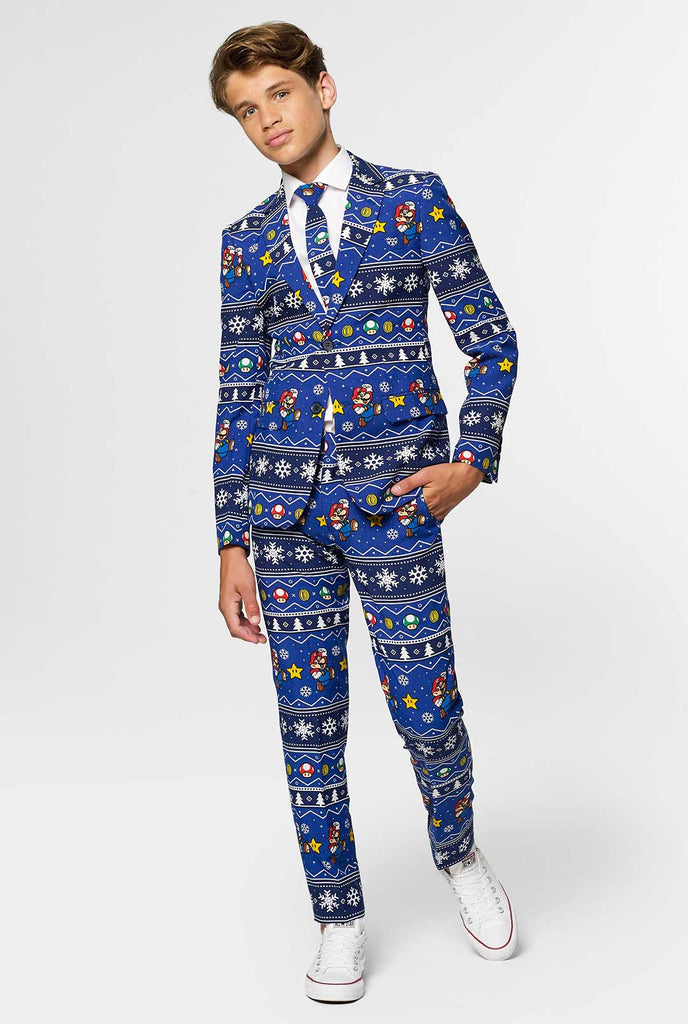Teen wearing blue Christmas suit with Super Mario print