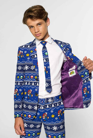 Teen wearing blue Christmas suit with Super Mario print