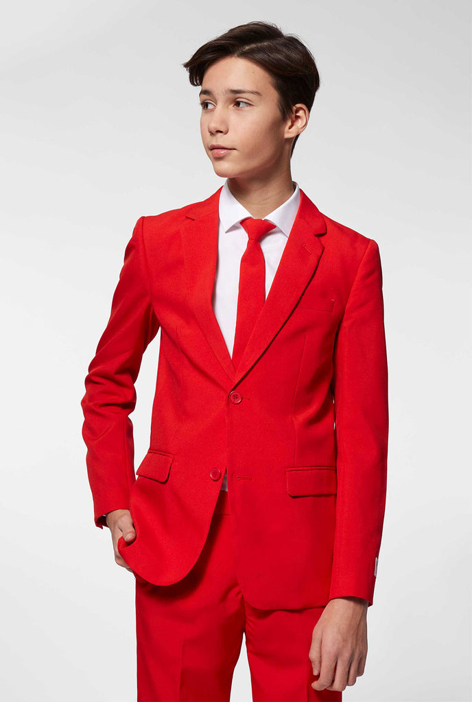 Teen wearing red formal suit