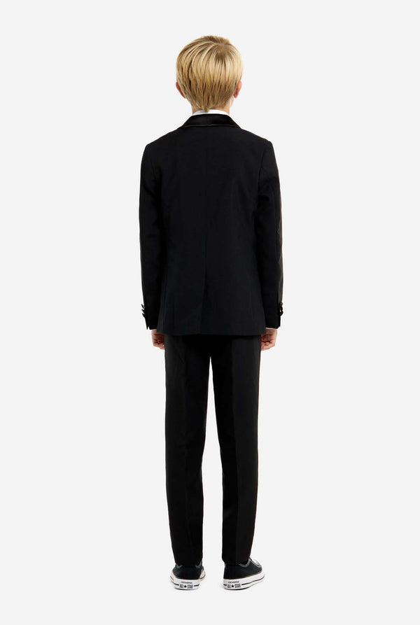 Person wearing a black suit on a white background