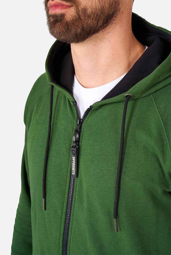 man wearing green onesie