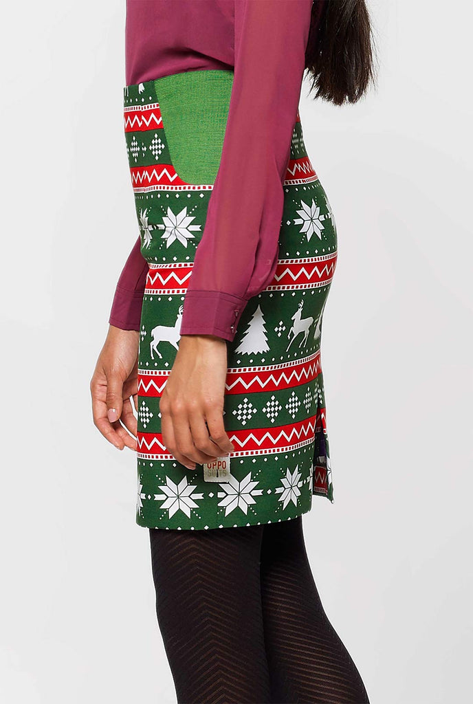 Woman wearing green and red Christmas suit