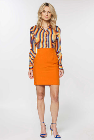 Woman wearing orange dress suit