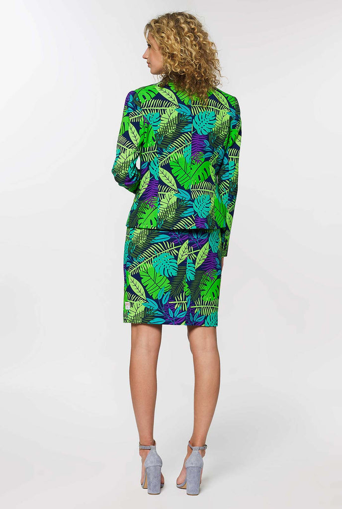 Woman wearing suit with green jungle leaves print