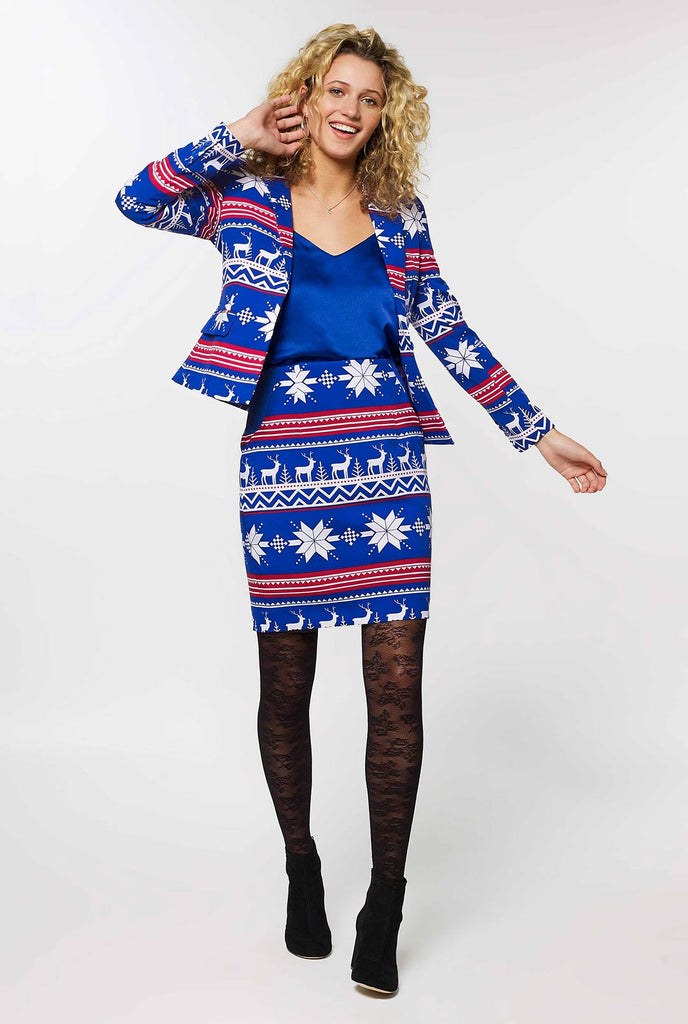Woman wearing blue and red Nordic themed Christmas suit