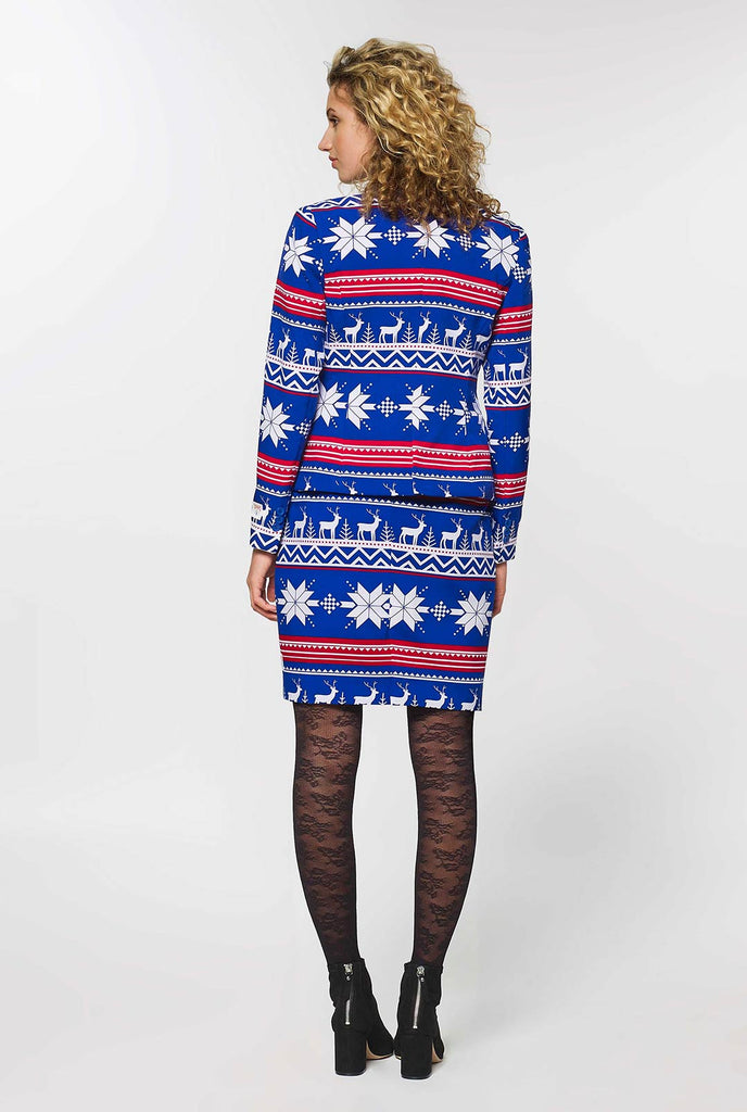 Woman wearing blue and red Nordic themed Christmas suit
