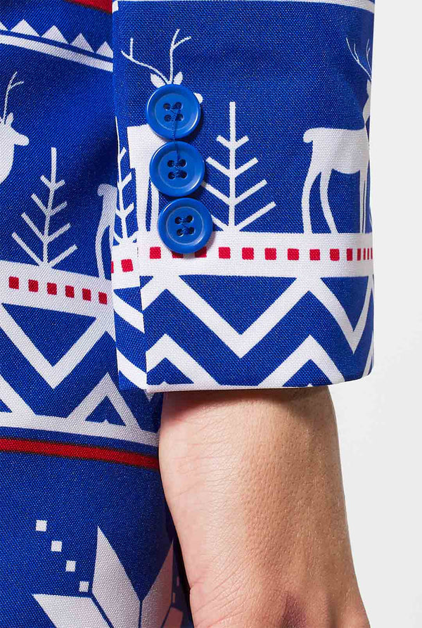 Woman wearing blue and red Nordic themed Christmas suit