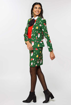 Woman wearing green suit with Christmas icons