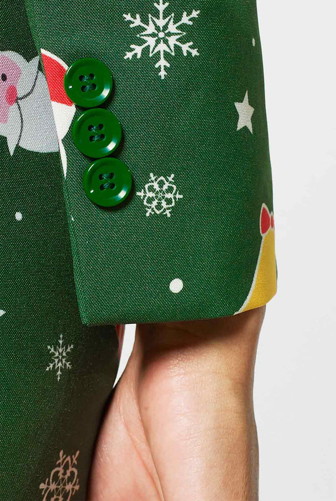 Woman wearing green suit with Christmas icons