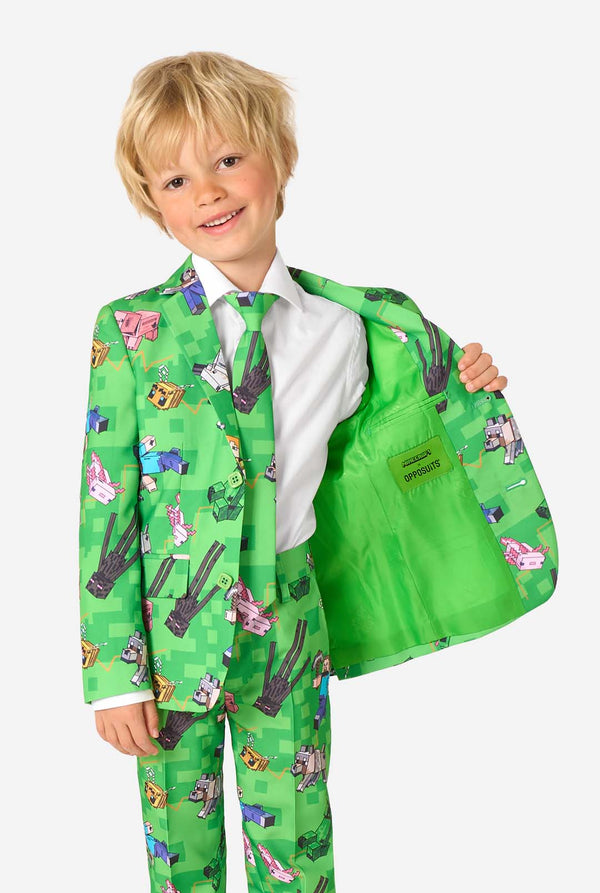 Kid showing the inside lining of a green Minecraft suit with official Minecraft and OppoSuits branding.