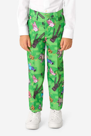 Close-up of Minecraft suit trousers featuring Creepers, pigs, and wolves in a pixel-style print, worn by kid.