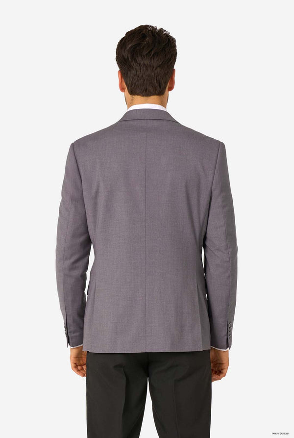 Gray suit jacket worn by a person on a grey background
