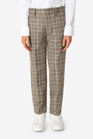 Person wearing brown checkered pants on a white background