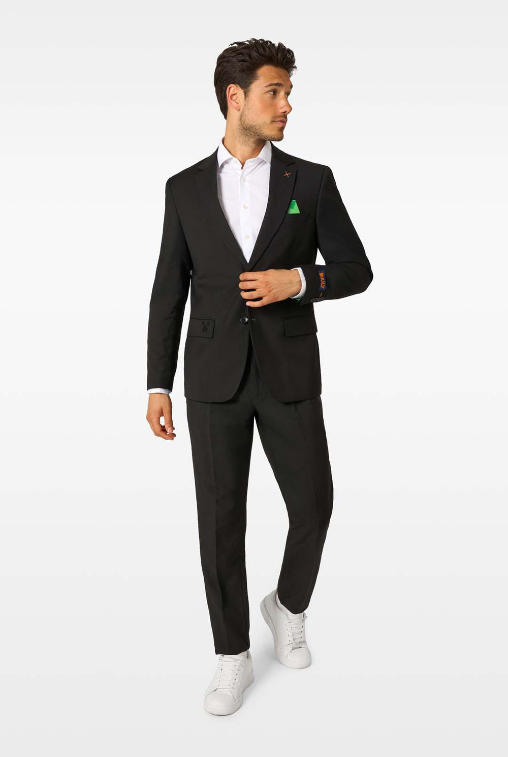 Man wearing a black suit with a white shirt on a white background