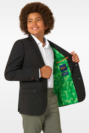 Child wearing a black blazer with a green Nautica jacket inside, on a white background
