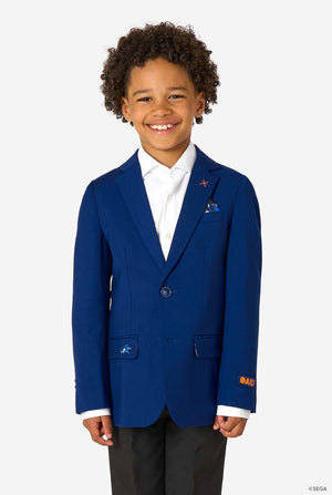 Child wearing a blue blazer with a white shirt and black pants on a white background