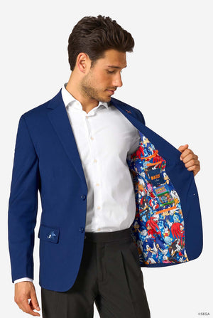 Man wearing a blue blazer with a colorful interior, standing against a white background
