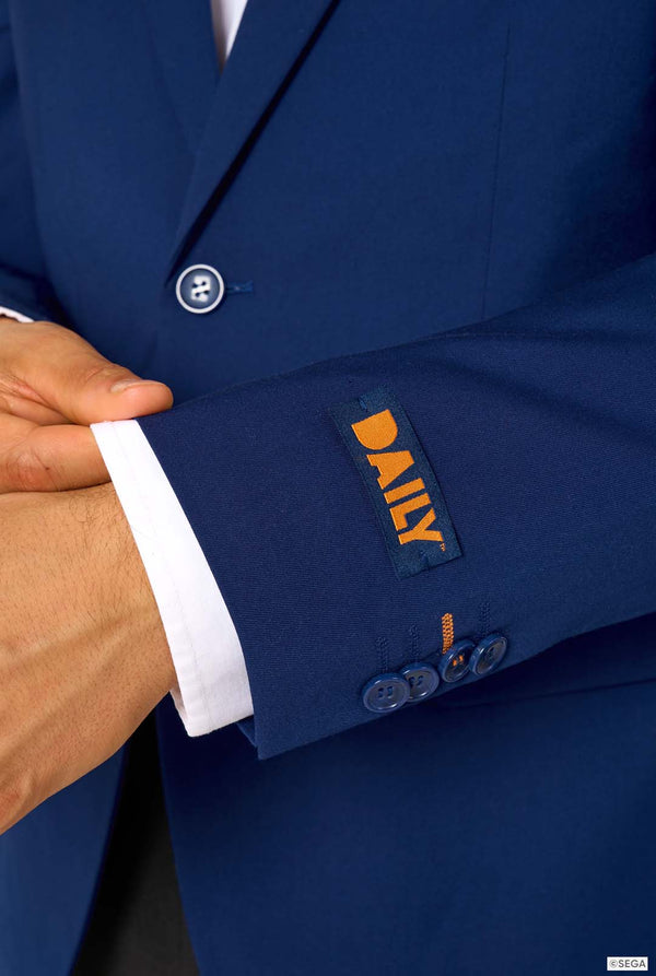 Close-up of a blue suit jacket with a brand label on the sleeve