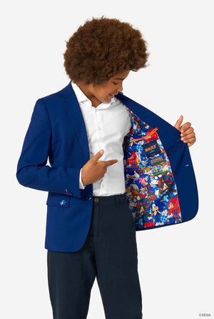 Person wearing a blue blazer with a colorful interior, standing against a white background