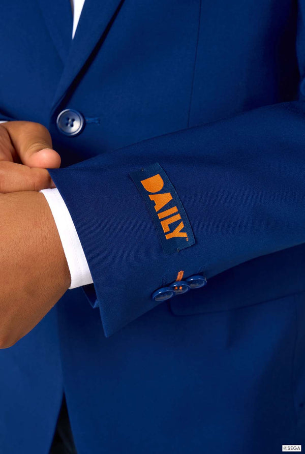 Close-up of a blue suit jacket with 'DAILY' branding on the sleeve.