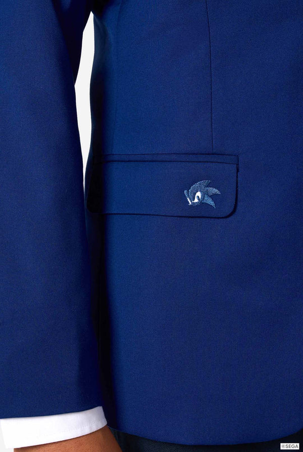 Close-up of a blue jacket with a logo on the chest pocket against a white background